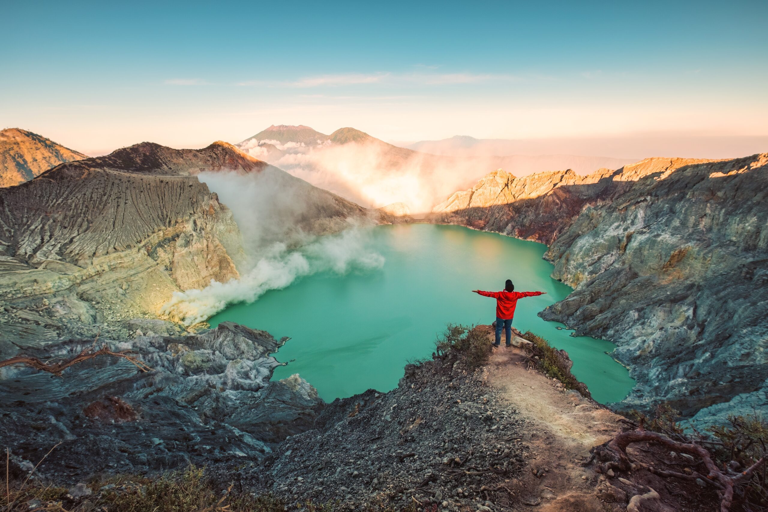 Successful,Traveler,Man,Standing,On,The,Crater,Of,Kawah,Ijen