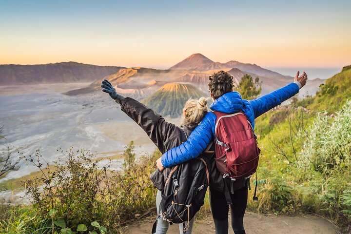 Couple admiring sunrise over Mount Bromo during private Bromo tour Malang